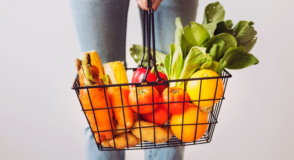 Woman holding vegetable basket